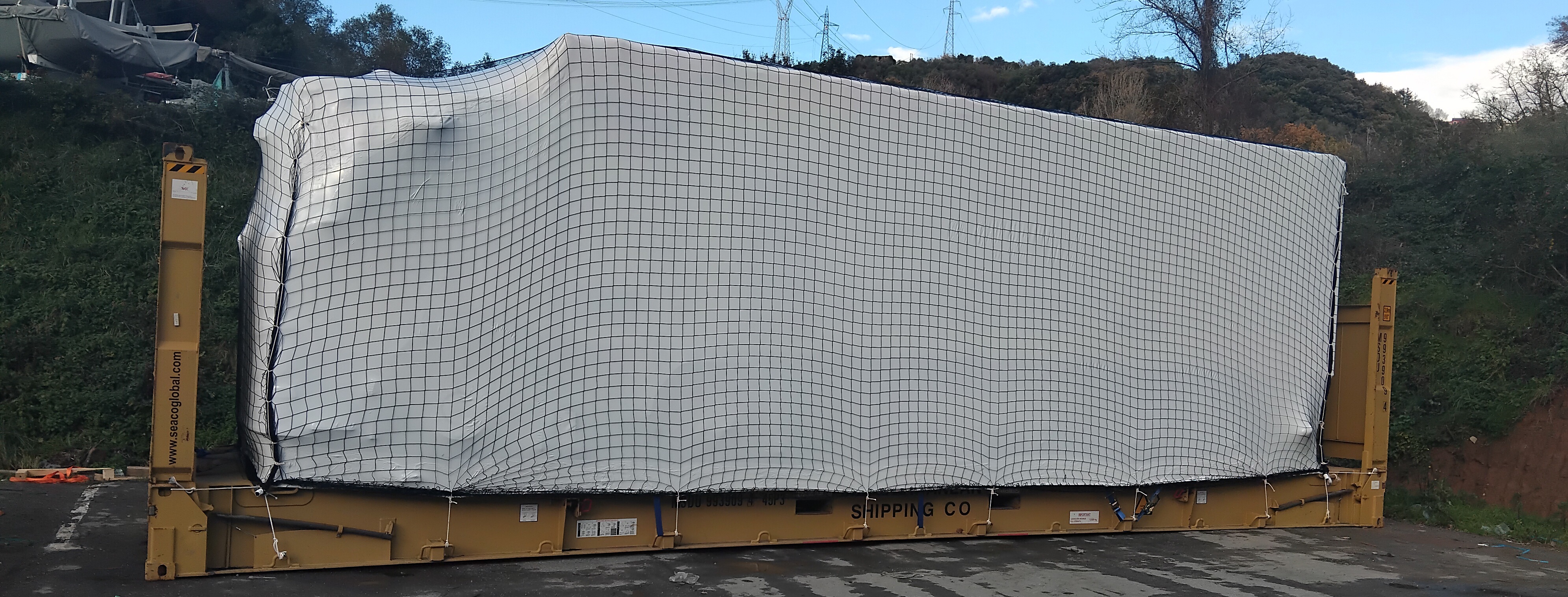 Truck loaded to 40-foot flat rack ready to ship